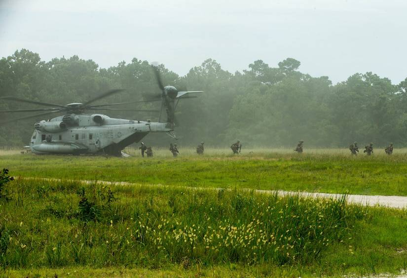 Marines with 3rd Battalion, 6th Marine Regiment, 2nd Marine Division, exit a CH-53 Super Stallion helicopter during Exercise Deep Water at Camp Lejeune, N.C., July 29, 2020.  Photo By: Marine Corps Cpl. Elijah J. Abernathy